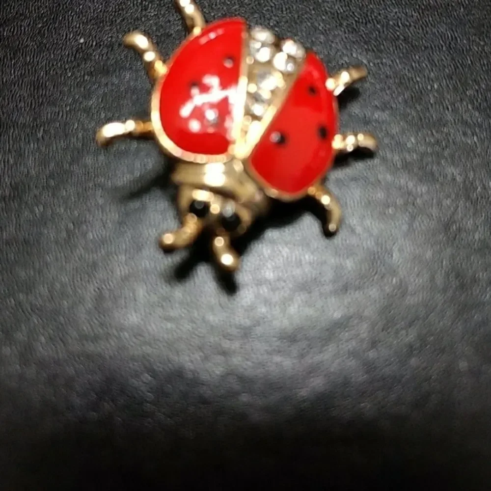 Gold tone and red enamel ladybug pin brooch